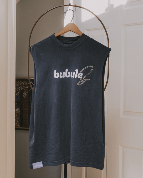 A black tank top on a clothing valet stand that says "bubulez" on the front.