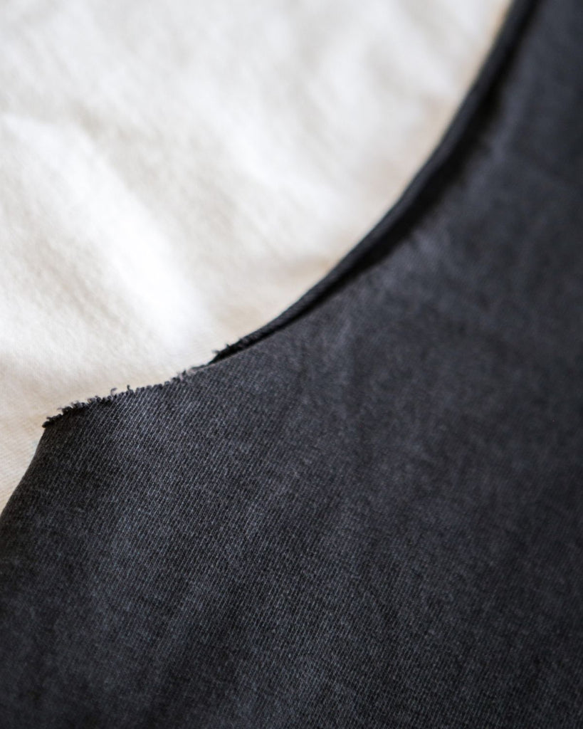 A photo of the faygeleh tank top with distressed arm holes.
