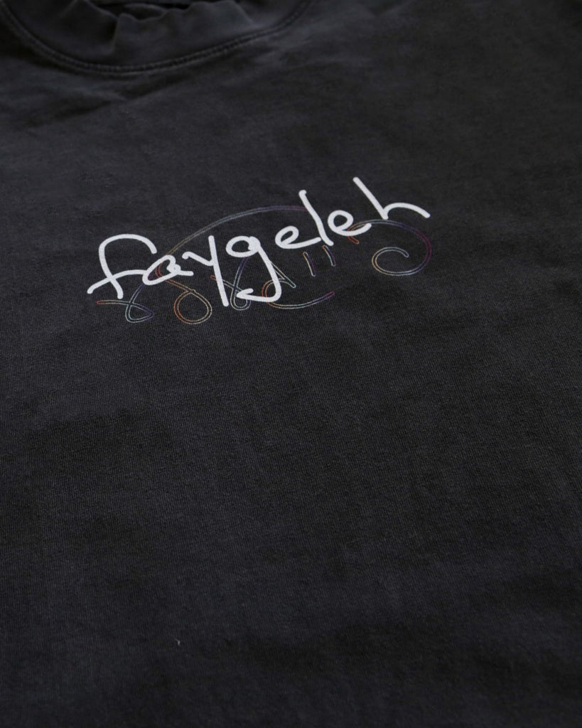 A black muscle tee made in Los Angeles showing the word faygeleh ("homosexual") in Yiddish and in English on the front.