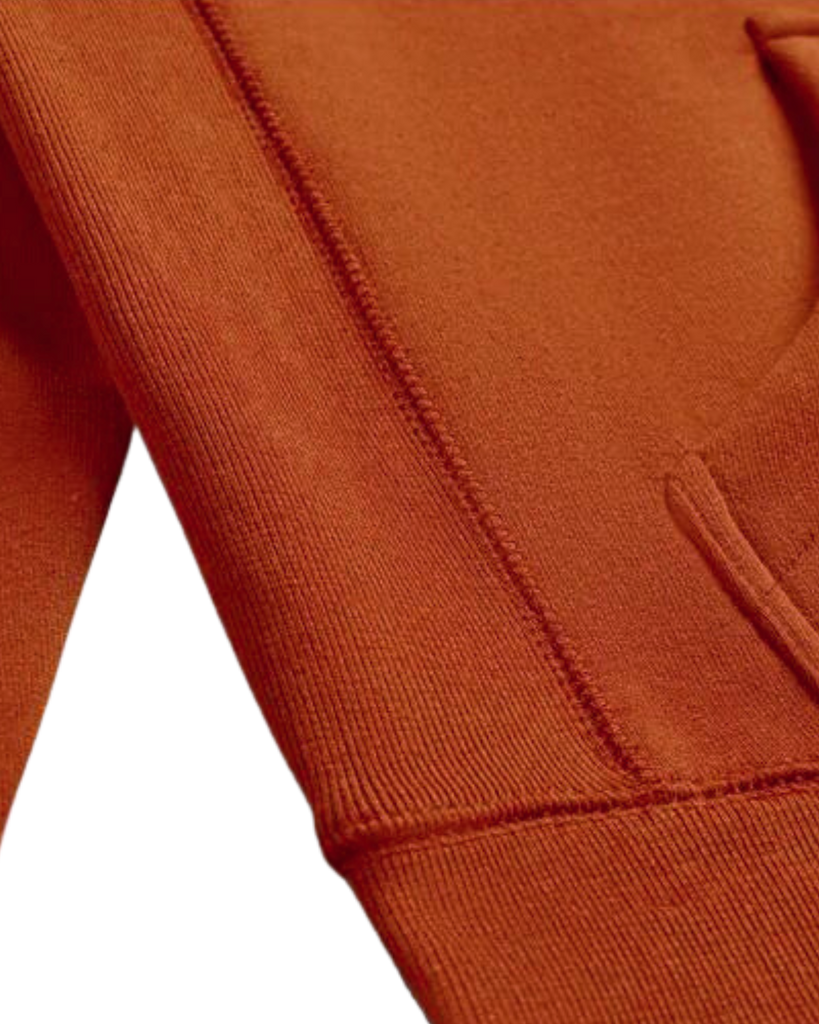 A detail closeup of the bubuleh handcrafted cinnamon heirloom hoodie showing expert stitching.
