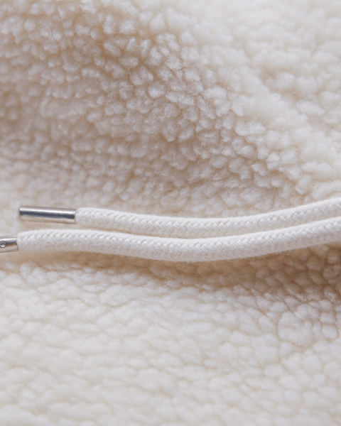 A details shot of the new white fleece and metal drawstring tips.