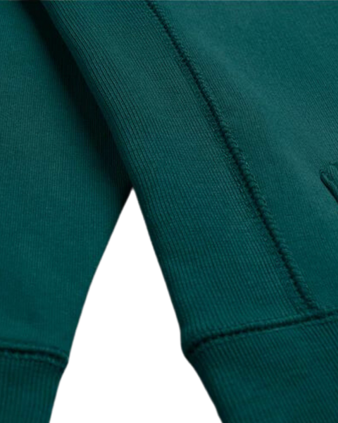 A detail closeup of the bubuleh handcrafted evergreen heirloom hoodie showing expert stitching.