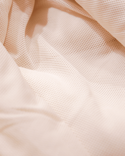 A detail shot of the 100% recycled mesh lining for the bubuleh sherpa hoodie.